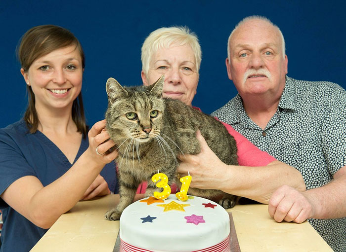 nutmeg with the vet and his parents